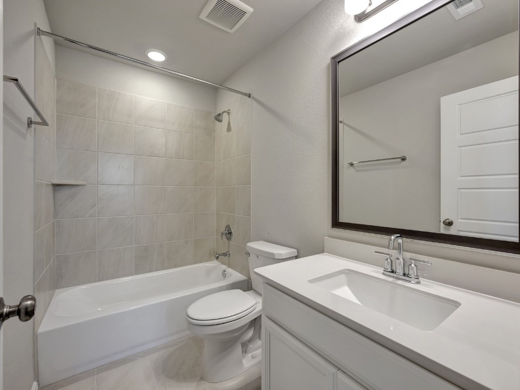 1669 Hopson Ranch Drive Conroe, TX 77301 - Photo 20 of 23 Photo is not of the actual home, but is an inspirational photo of builder’s model home and may depict options, furnishings, and/or decorator features that are not included