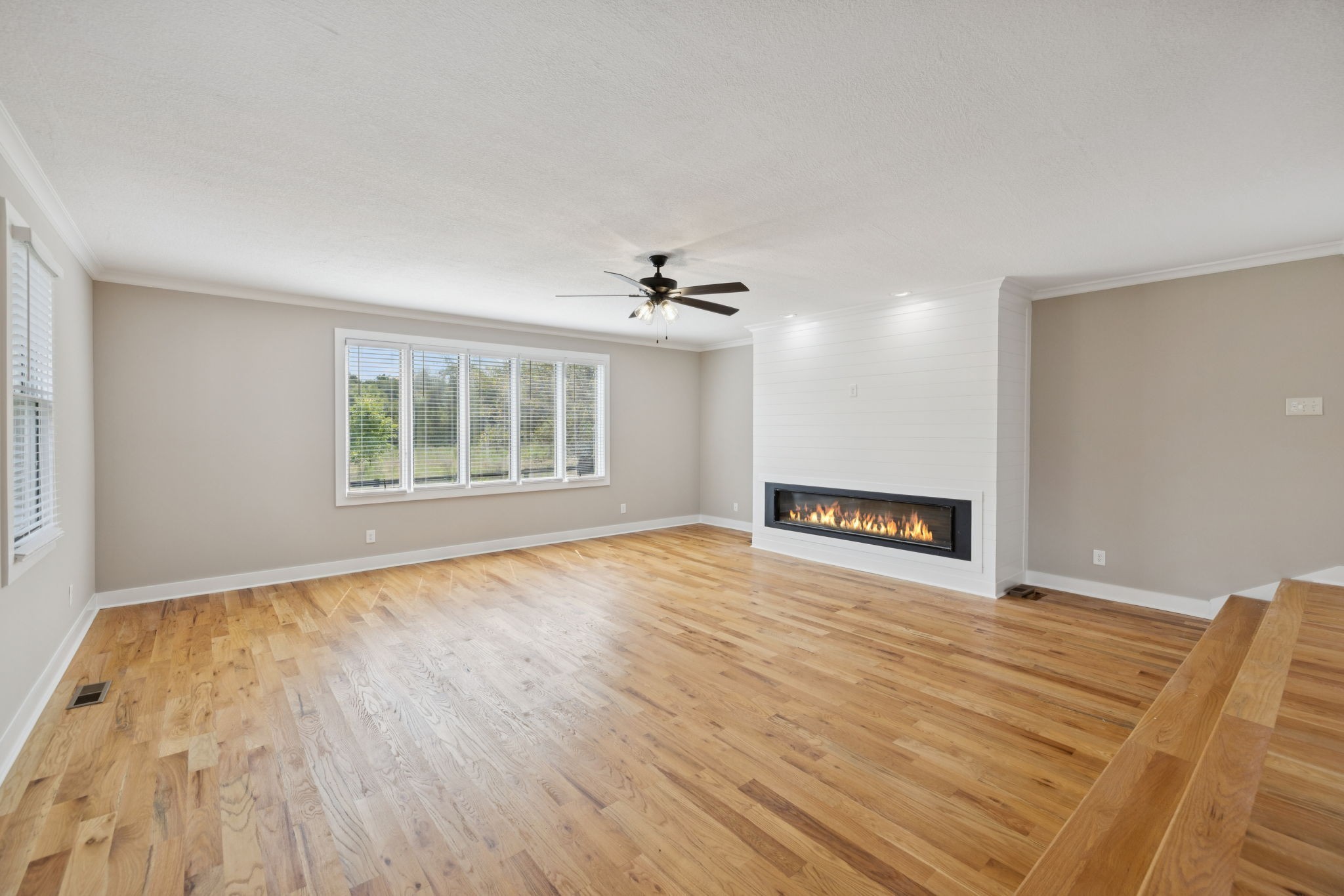 3935 Harmony Grove Road Hopkinsville, KY 42240 - Photo 16 of 64 a view of an empty room with a window and wooden floor