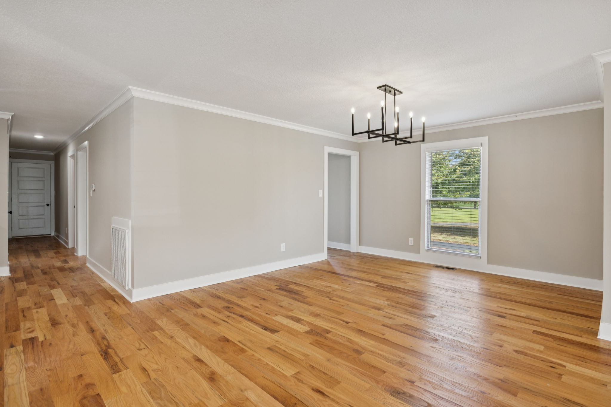 3935 Harmony Grove Road Hopkinsville, KY 42240 - Photo 18 of 64 wooden floor in an empty room with a window