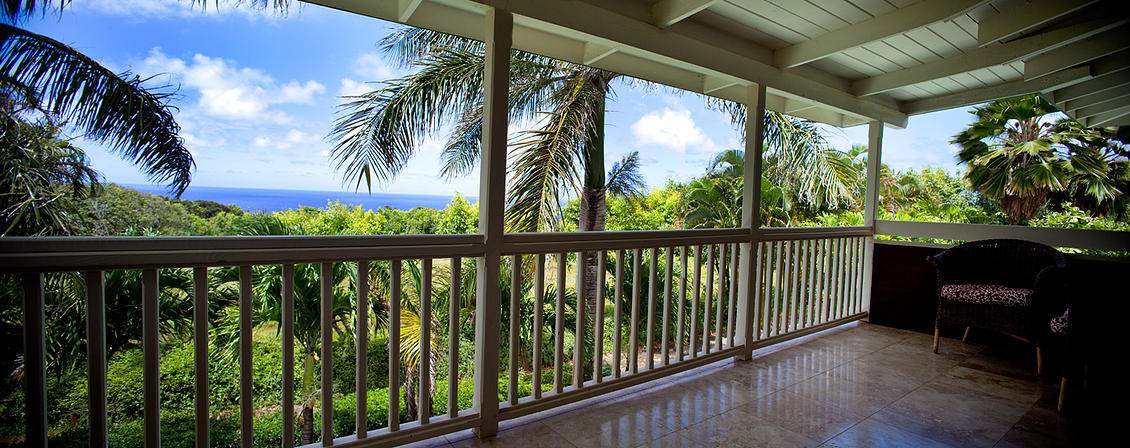435 Hoolawa Road Haiku, HI 96708 - Photo 3 of 30 a view of balcony with floor to ceiling window and outdoor seating