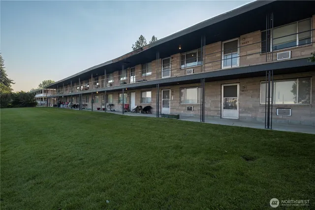 a view of house with yard