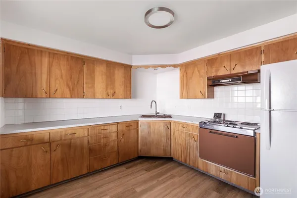a kitchen with a sink and cabinets