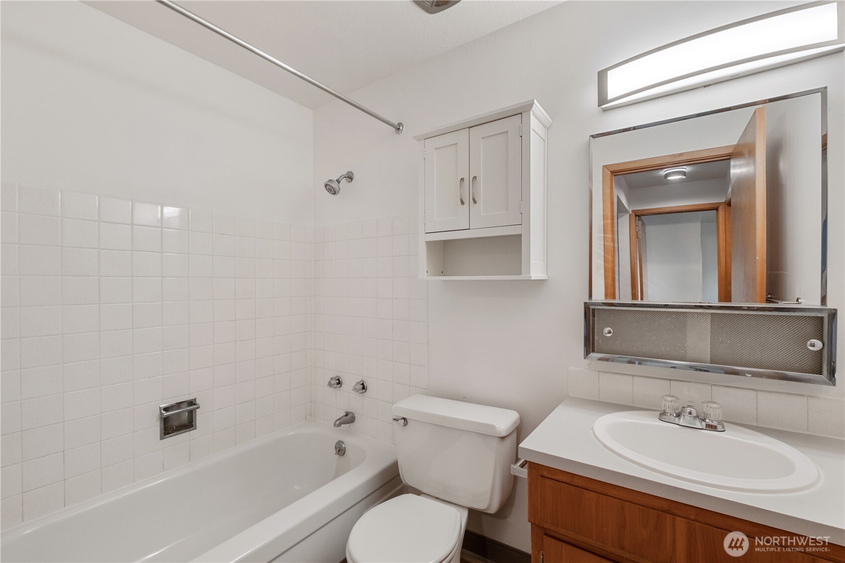 6615 North Atlantic Street Spokane, WA 99208 - Photo 10 of 22 a bathroom with a sink toilet a mirror and shower