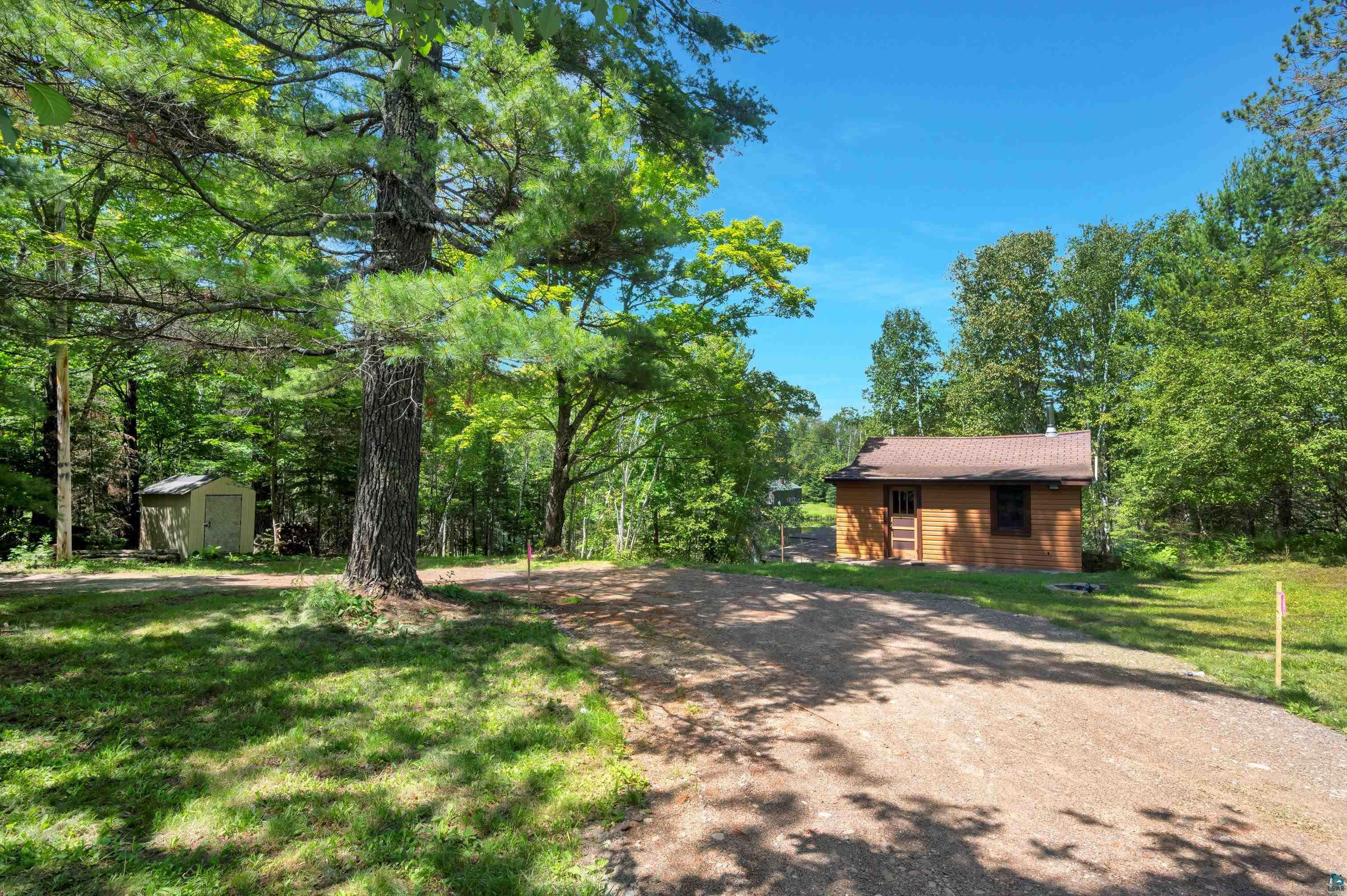 4365 Tarnowski Road Duluth, MN 55803 - Photo 6 of 9 View of front of house with a shed and a front yard