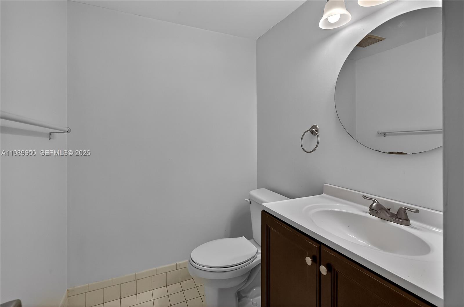 400 Southwest 134th Way, Unit 112F Pembroke Pines, FL 33027 - Photo 11 of 40 a bathroom with a sink and a toilet