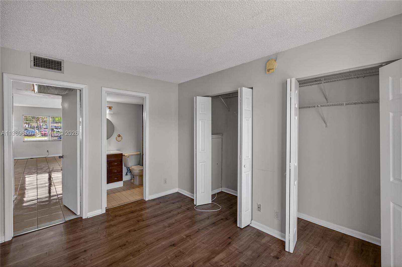 400 Southwest 134th Way, Unit 112F Pembroke Pines, FL 33027 - Photo 13 of 40 wooden floor with white walls