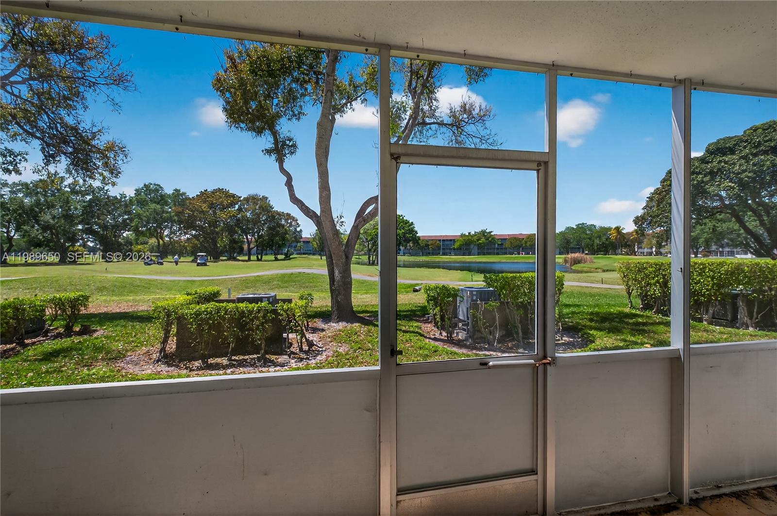 400 Southwest 134th Way, Unit 112F Pembroke Pines, FL 33027 - Photo 17 of 40 a view of a house with a garden and a lake view