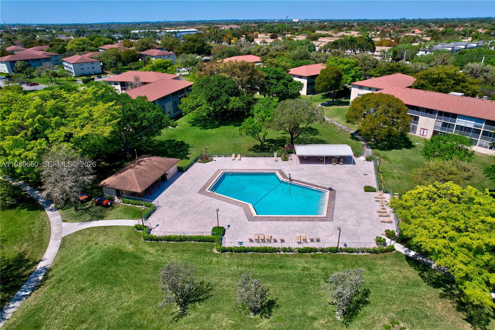 400 Southwest 134th Way, Unit 112F Pembroke Pines, FL 33027 - Photo 30 of 40 an aerial view of house with yard swimming pool and outdoor seating
