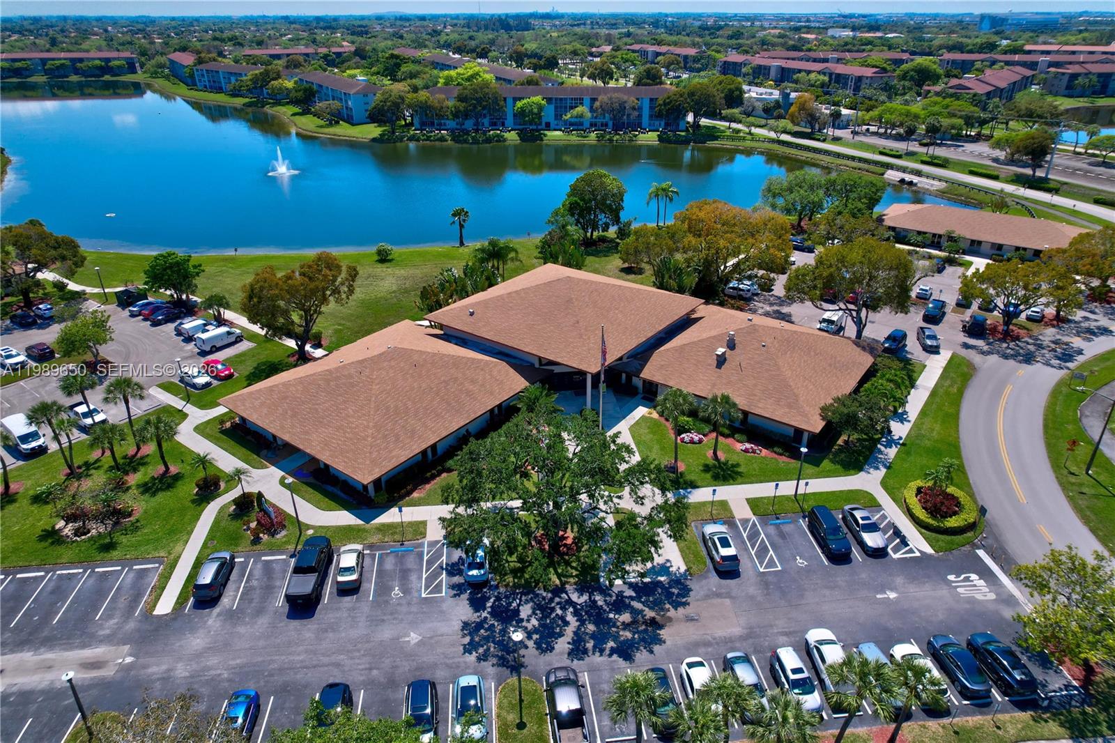 400 Southwest 134th Way, Unit 112F Pembroke Pines, FL 33027 - Photo 33 of 40 an aerial view of a house with a garden and lake view