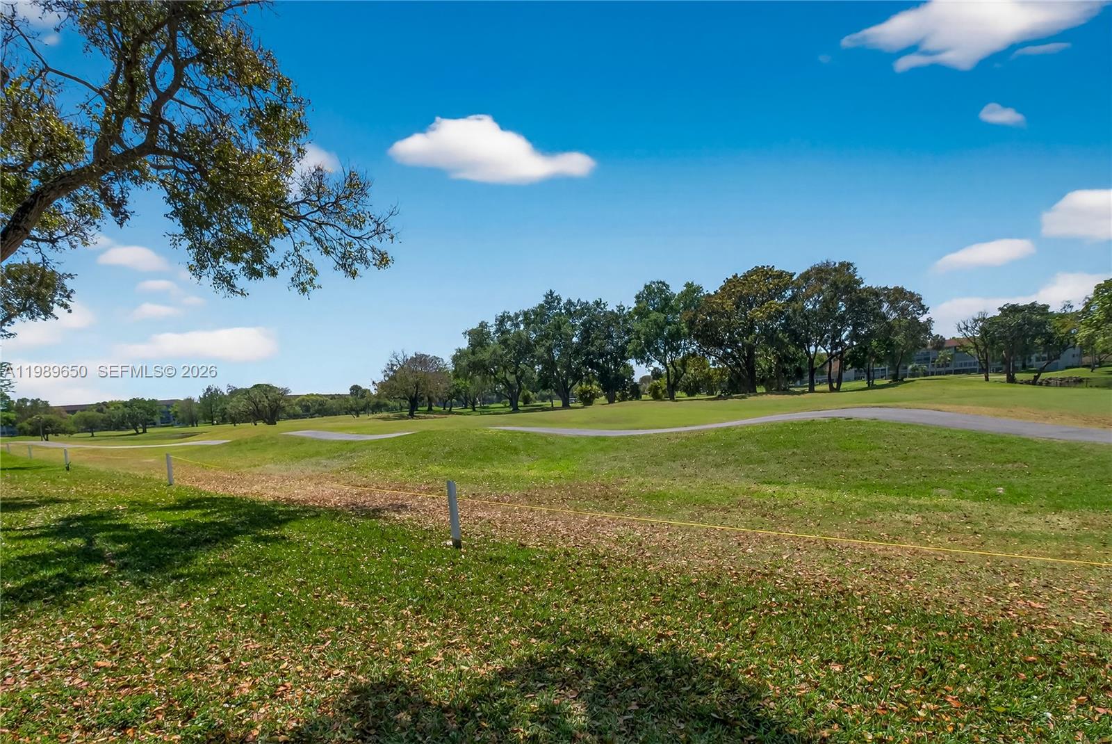 400 Southwest 134th Way, Unit 112F Pembroke Pines, FL 33027 - Photo 37 of 40 a view of a lake with a big yard
