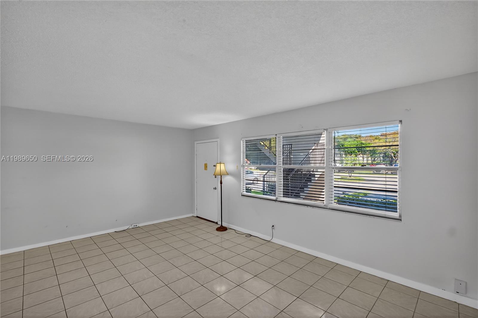 400 Southwest 134th Way, Unit 112F Pembroke Pines, FL 33027 - Photo 6 of 40 a view of an empty room with a window