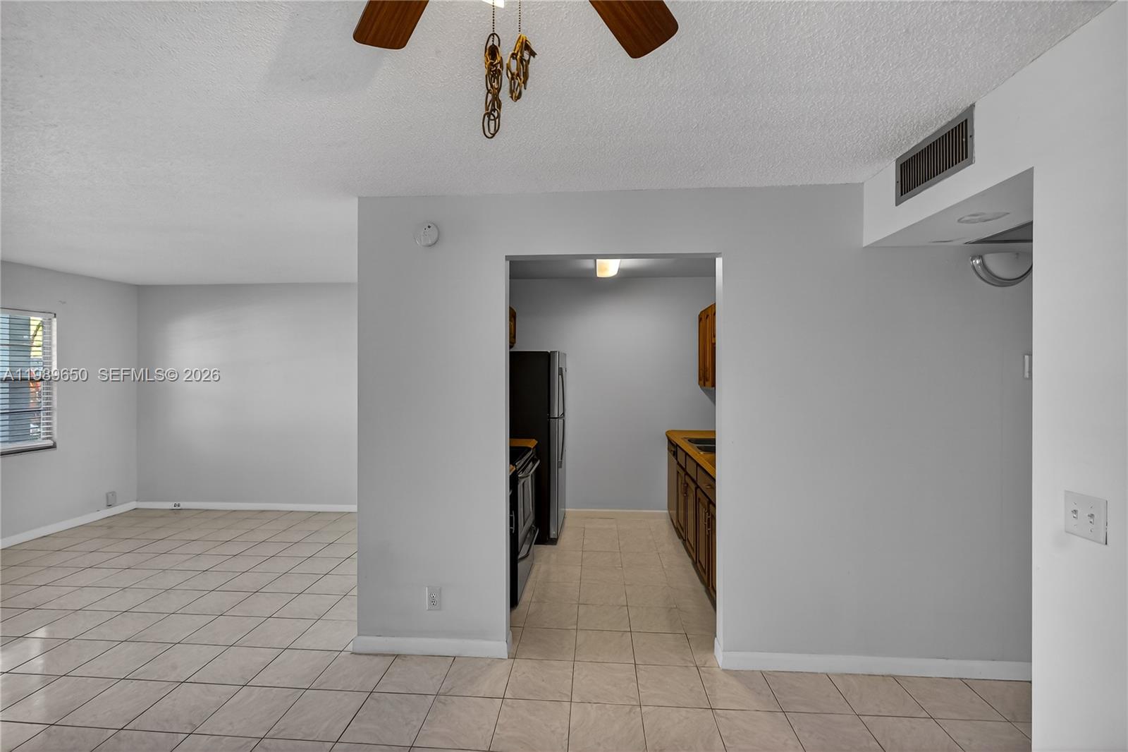 400 Southwest 134th Way, Unit 112F Pembroke Pines, FL 33027 - Photo 8 of 40 wooden floor in an empty room