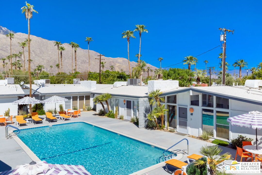 1655 Andee Drive Palm Springs, CA 92264 - Photo 26 of 26 a view of a house with a big yard and potted plants