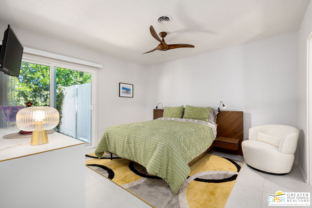 1655 Andee Drive Palm Springs, CA 92264 - Photo 6 of 26 a bedroom with a bed and window