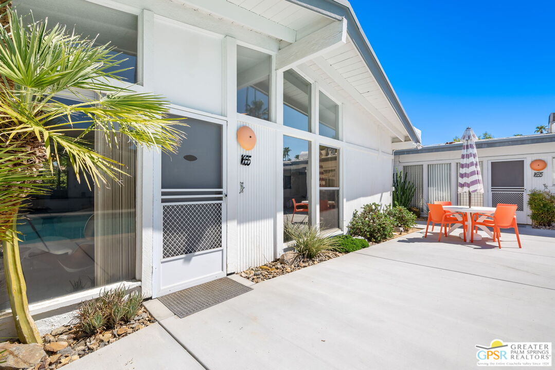 1655 Andee Drive Palm Springs, CA 92264 - Photo 8 of 26 a front view of a house with a porch