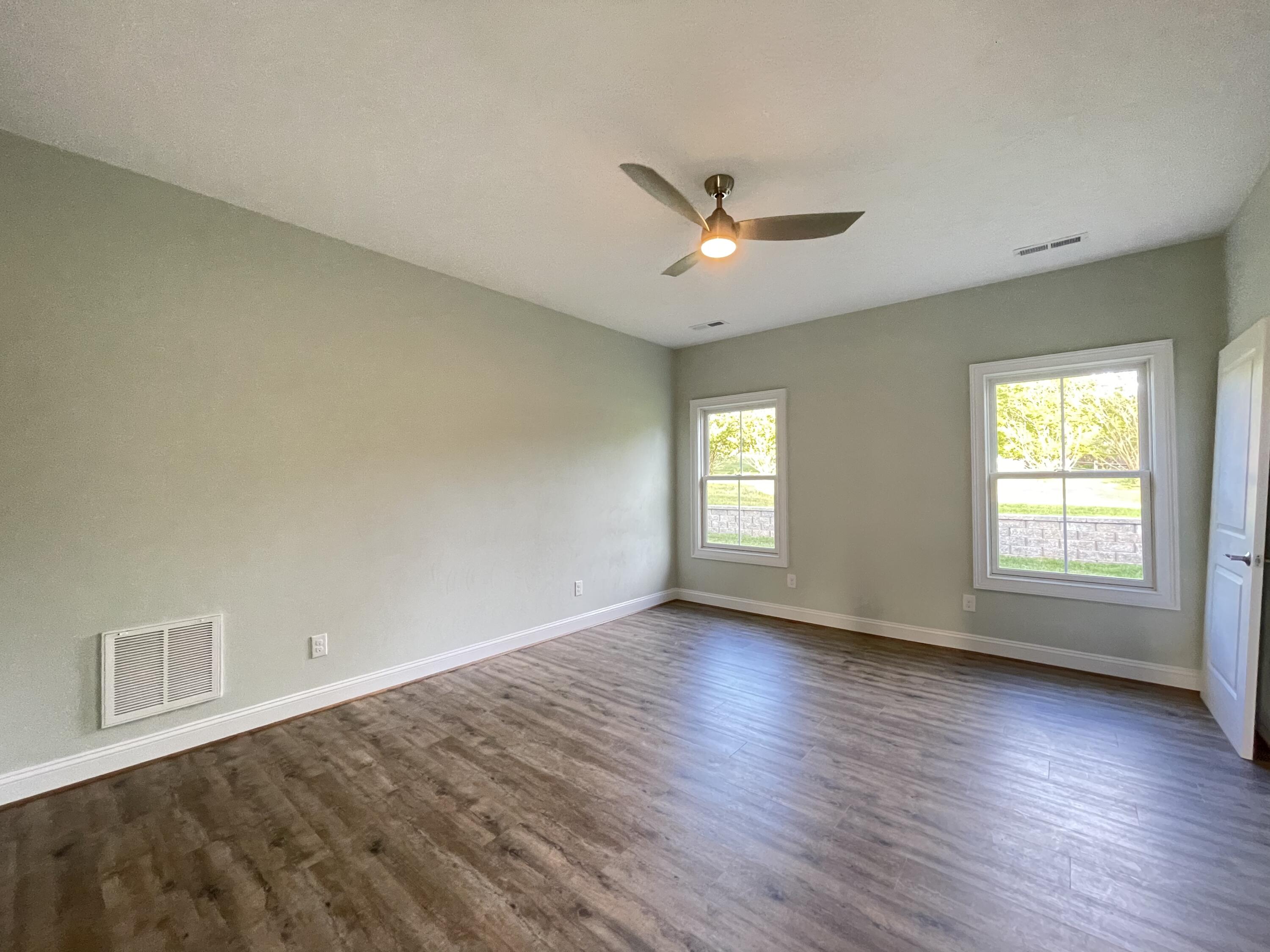 1675 Mountain View Road Vinton, VA 24179 - Photo 14 of 31 a view of an empty room with a window and wooden floor
