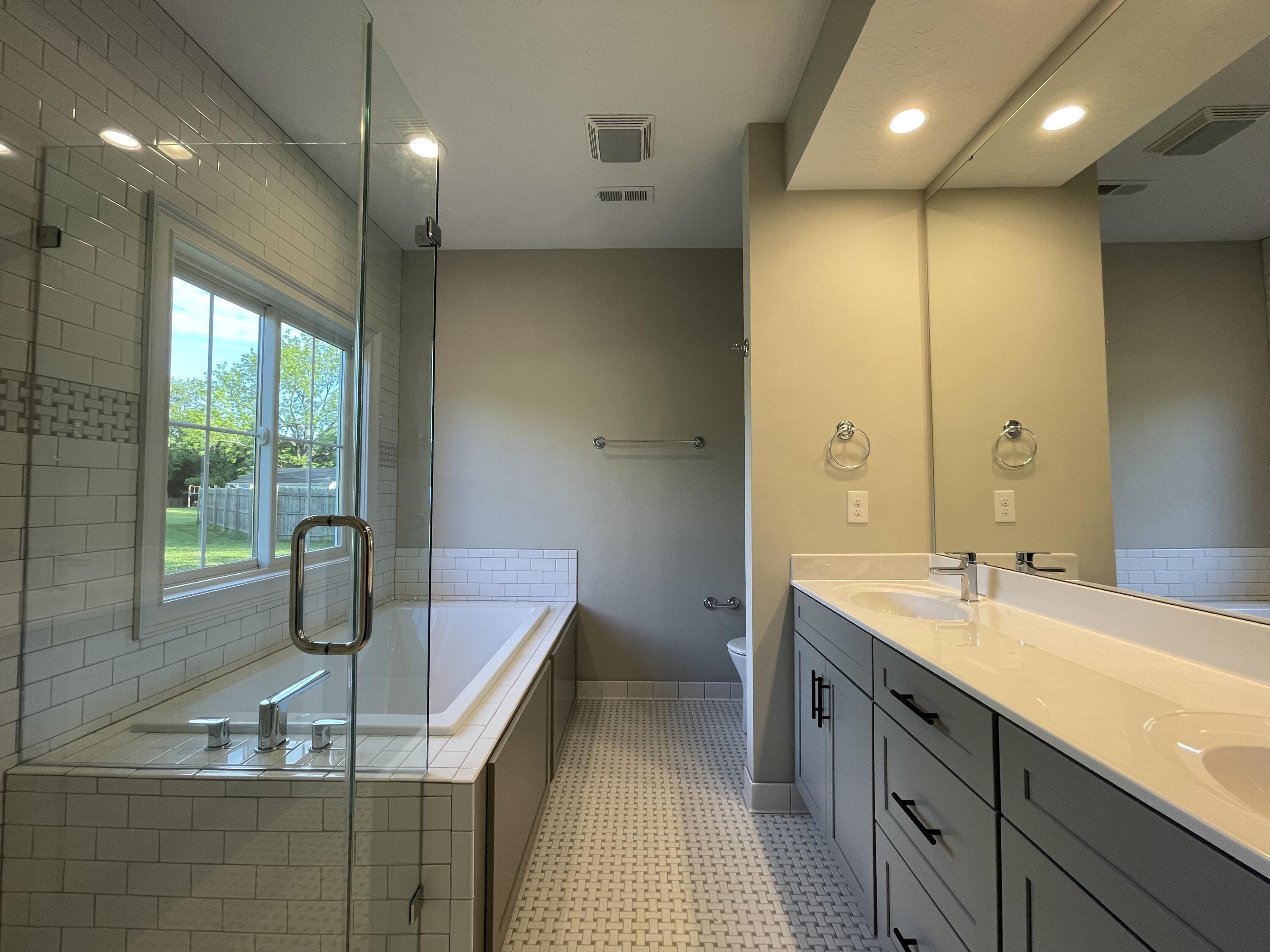 1675 Mountain View Road Vinton, VA 24179 - Photo 15 of 31 a bathroom with a double vanity sink a mirror and shower