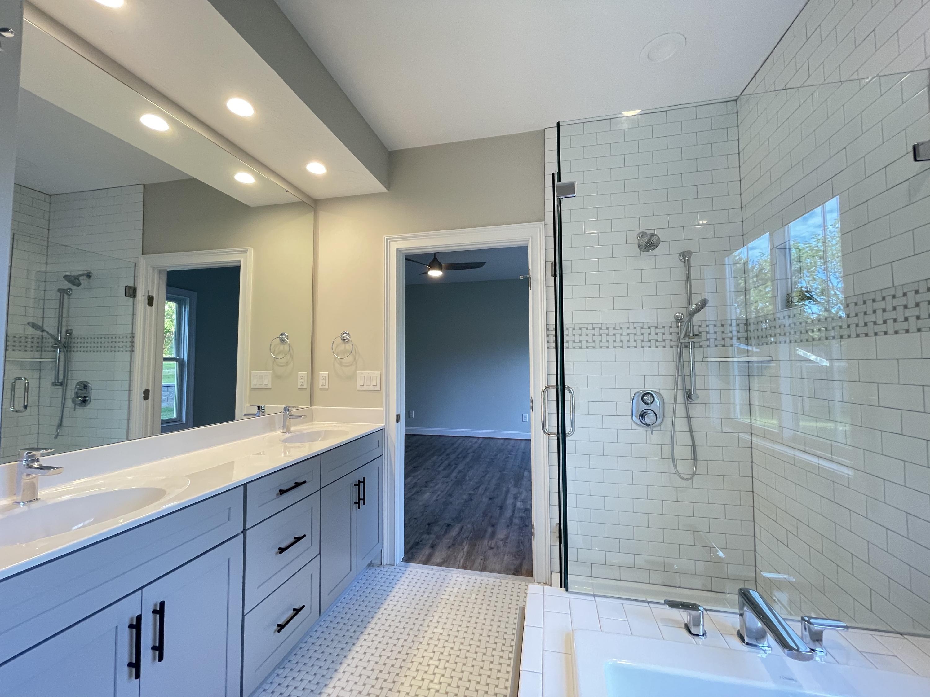 1675 Mountain View Road Vinton, VA 24179 - Photo 17 of 31 a spacious bathroom with a sink a shower and a mirror