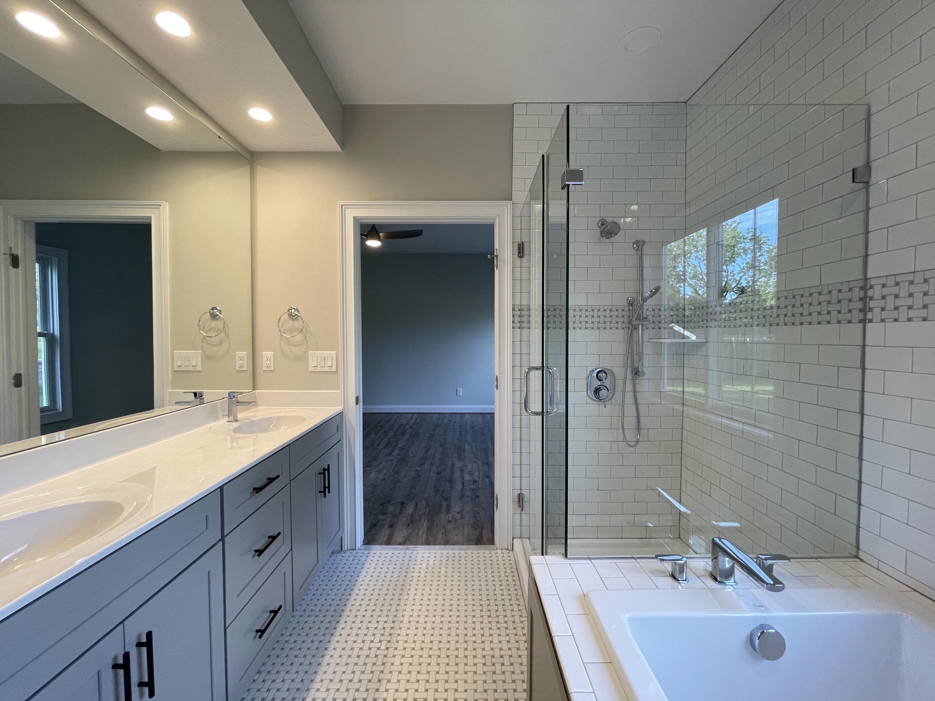1675 Mountain View Road Vinton, VA 24179 - Photo 18 of 31 a bathroom with a sink double vanity granite tub and shower