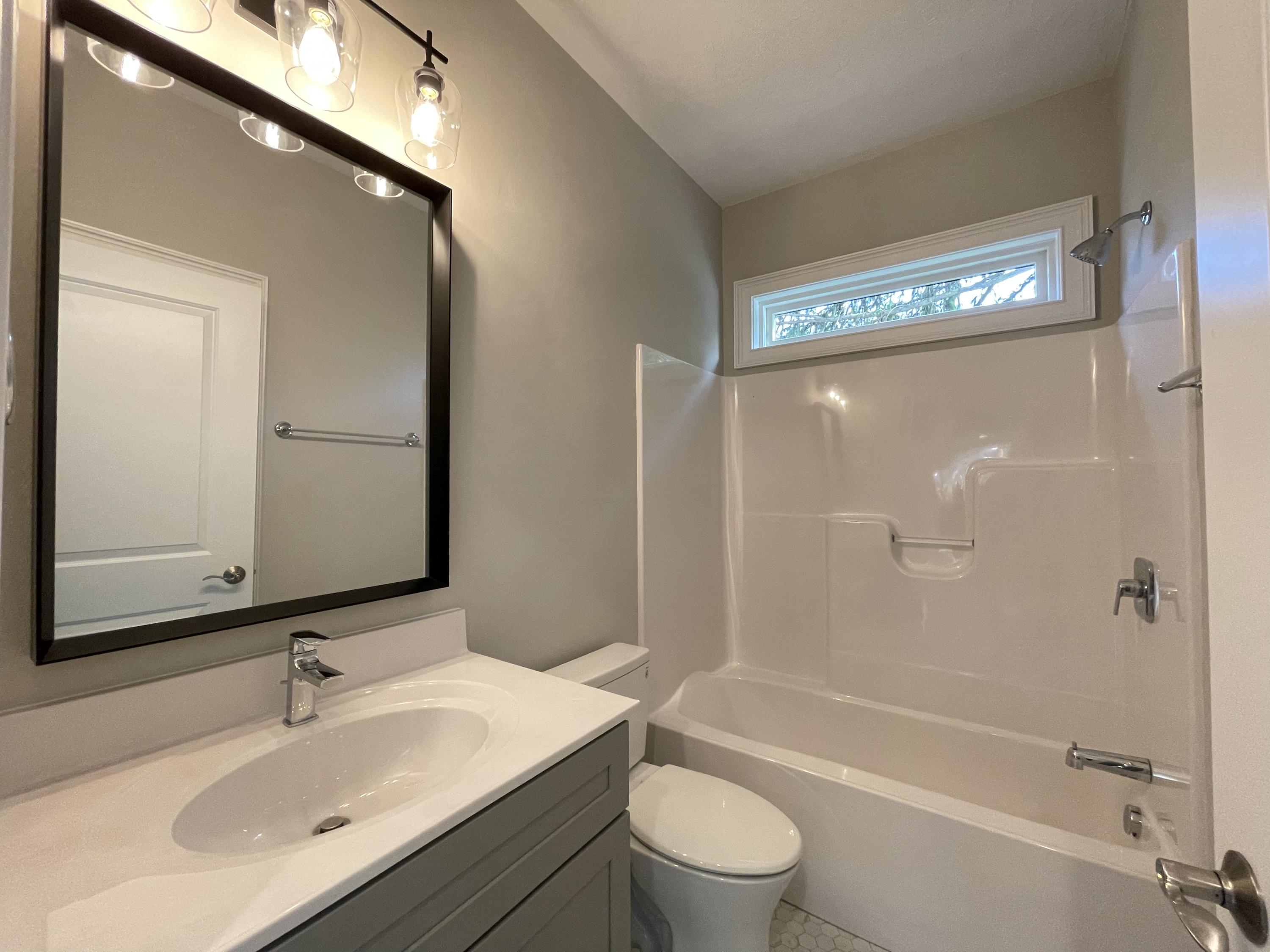 1675 Mountain View Road Vinton, VA 24179 - Photo 21 of 31 a bathroom with a bathtub shower sink vanity and toilet