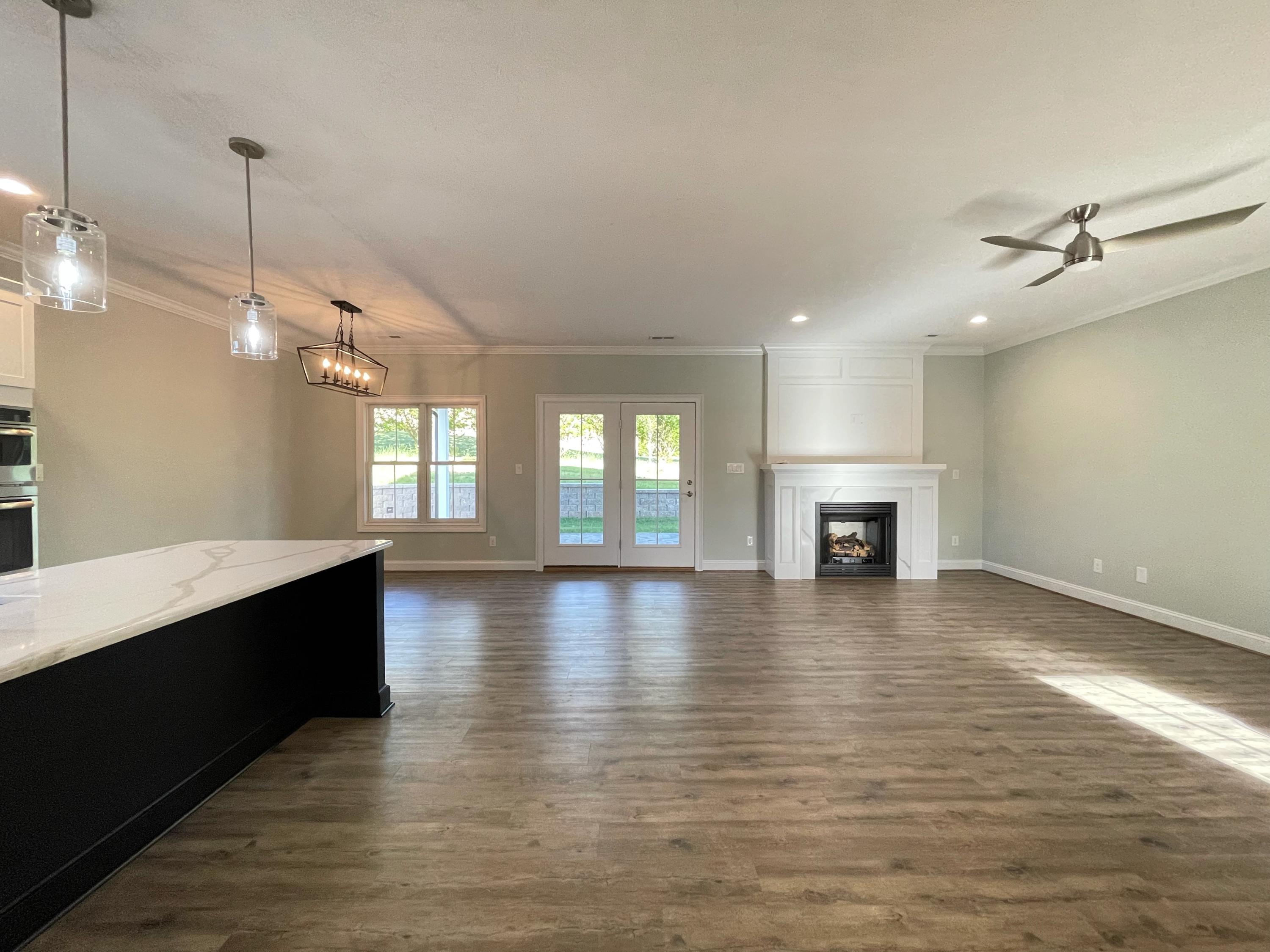 1675 Mountain View Road Vinton, VA 24179 - Photo 5 of 31 a view of empty room with wooden floor and fireplace