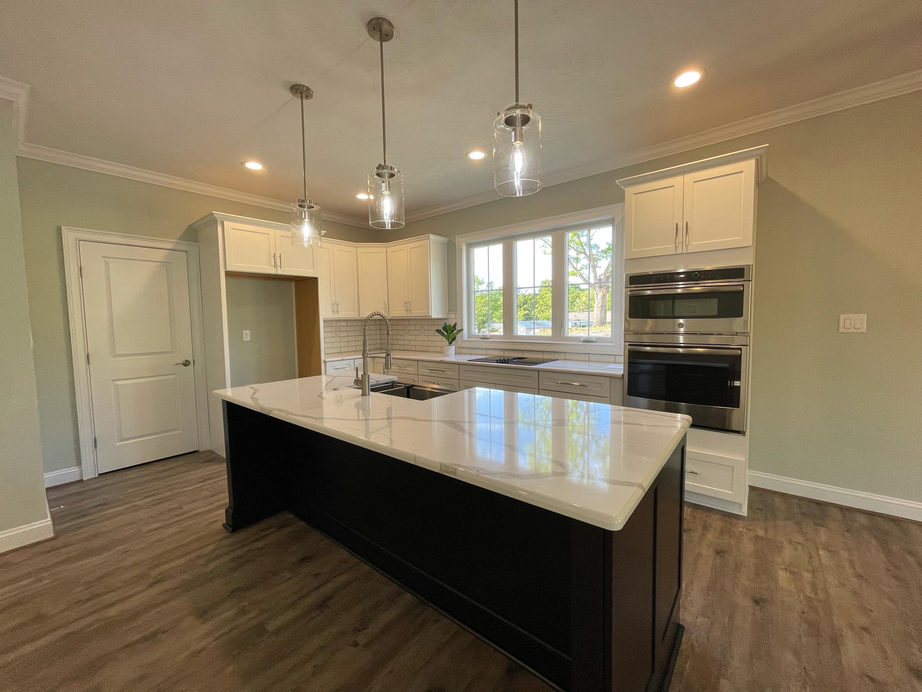 1675 Mountain View Road Vinton, VA 24179 - Photo 7 of 31 a kitchen with kitchen island a sink appliances and wooden floor