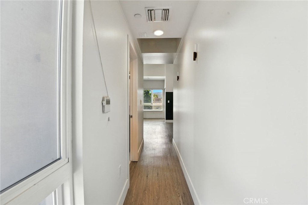 4461 Tujunga Avenue, Unit 101 Studio City, CA 91602 - Photo 15 of 34 a view of a hallway with wooden floor