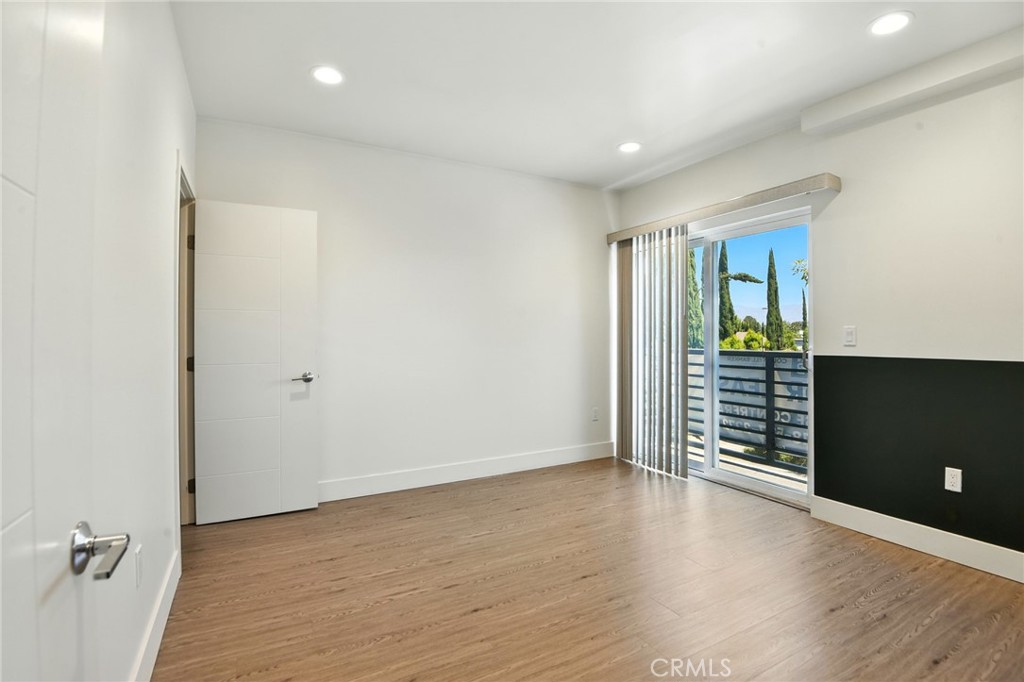 4461 Tujunga Avenue, Unit 101 Studio City, CA 91602 - Photo 20 of 34 wooden floor in an empty room with a window