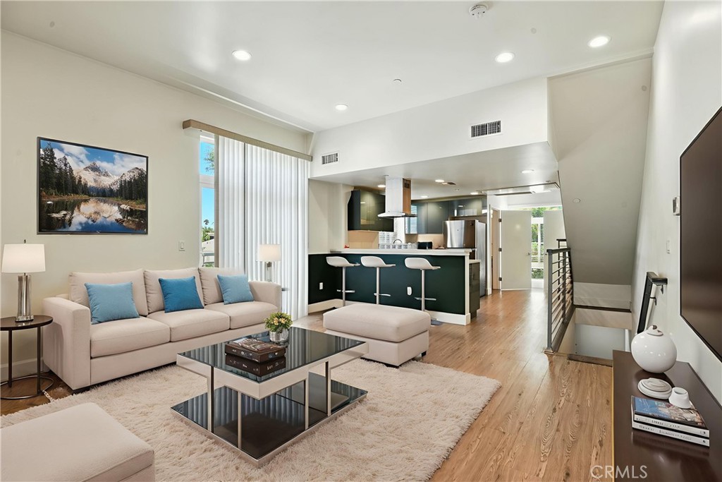 4461 Tujunga Avenue, Unit 101 Studio City, CA 91602 - Photo 2 of 34 a living room with furniture and a flat screen tv