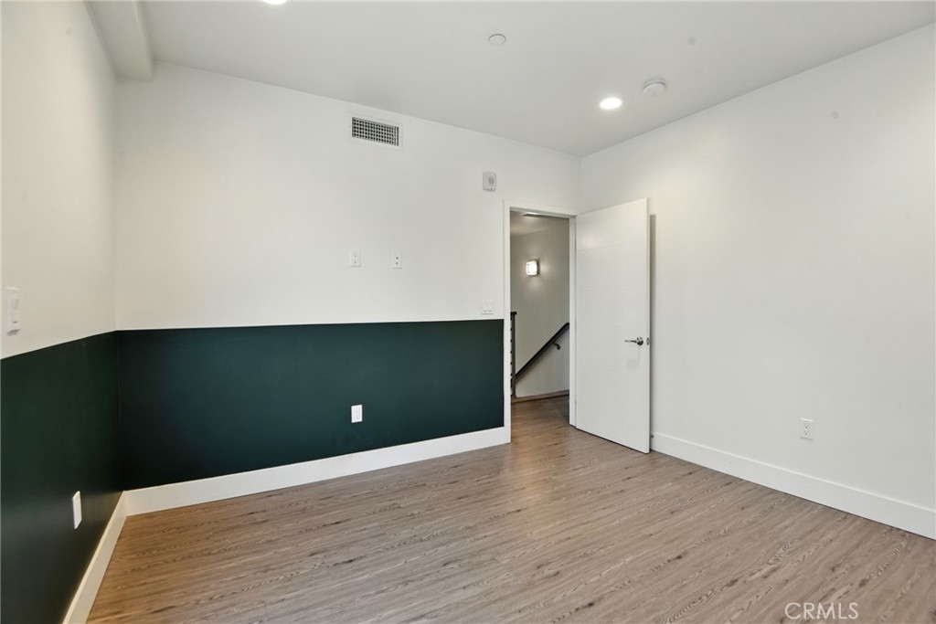 4461 Tujunga Avenue, Unit 101 Studio City, CA 91602 - Photo 21 of 34 a view of an empty room with wooden floor