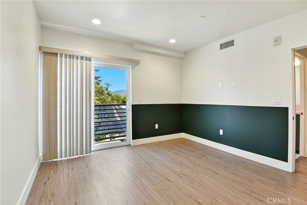 4461 Tujunga Avenue, Unit 101 Studio City, CA 91602 - Photo 22 of 34 wooden floor in an empty room with a window