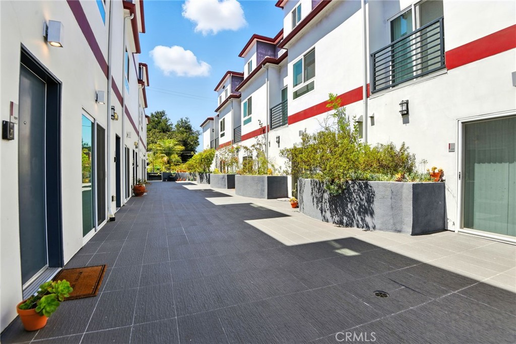 4461 Tujunga Avenue, Unit 101 Studio City, CA 91602 - Photo 6 of 34 a view of a street with potted plants