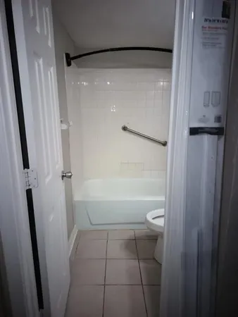 a bathroom with a glass door shower