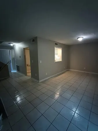 a view of an empty room and window