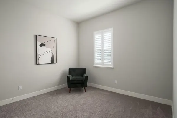 an empty room with windows and bench