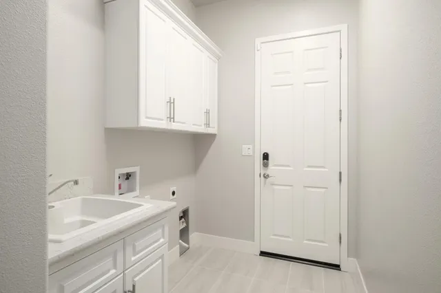 a bathroom with a sink and a window