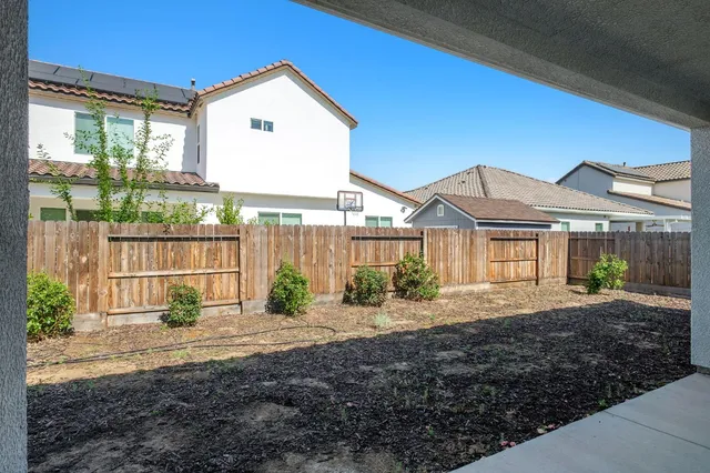 a house with yard in front of it
