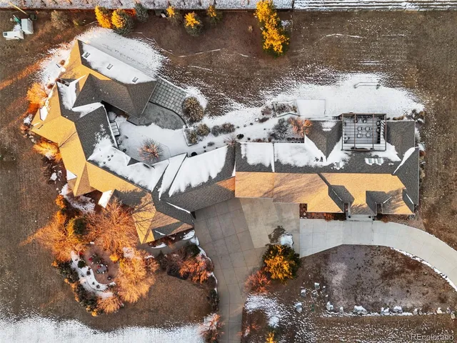 a living room with furniture a fireplace and a chandelier