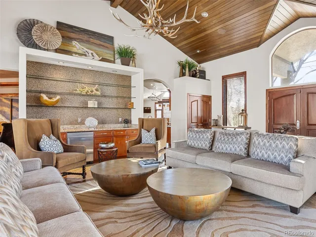 a spacious bathroom with stainless steel appliances granite countertop a sink and a bathtub