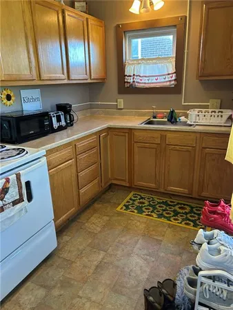 a kitchen with a sink and cabinets