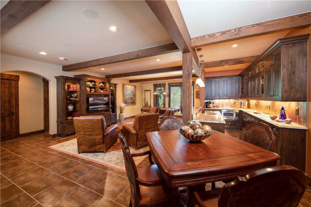 130 Hunter's Knob Road Silverthorne, CO 80498 - Photo 25 of 35 Lower level recreation area is a true entertainers paradise with extensive bar area, surround sound media, game table and billiards. Don't miss the self contained wine cellar with laser etched door and tile mosaic on back wall.