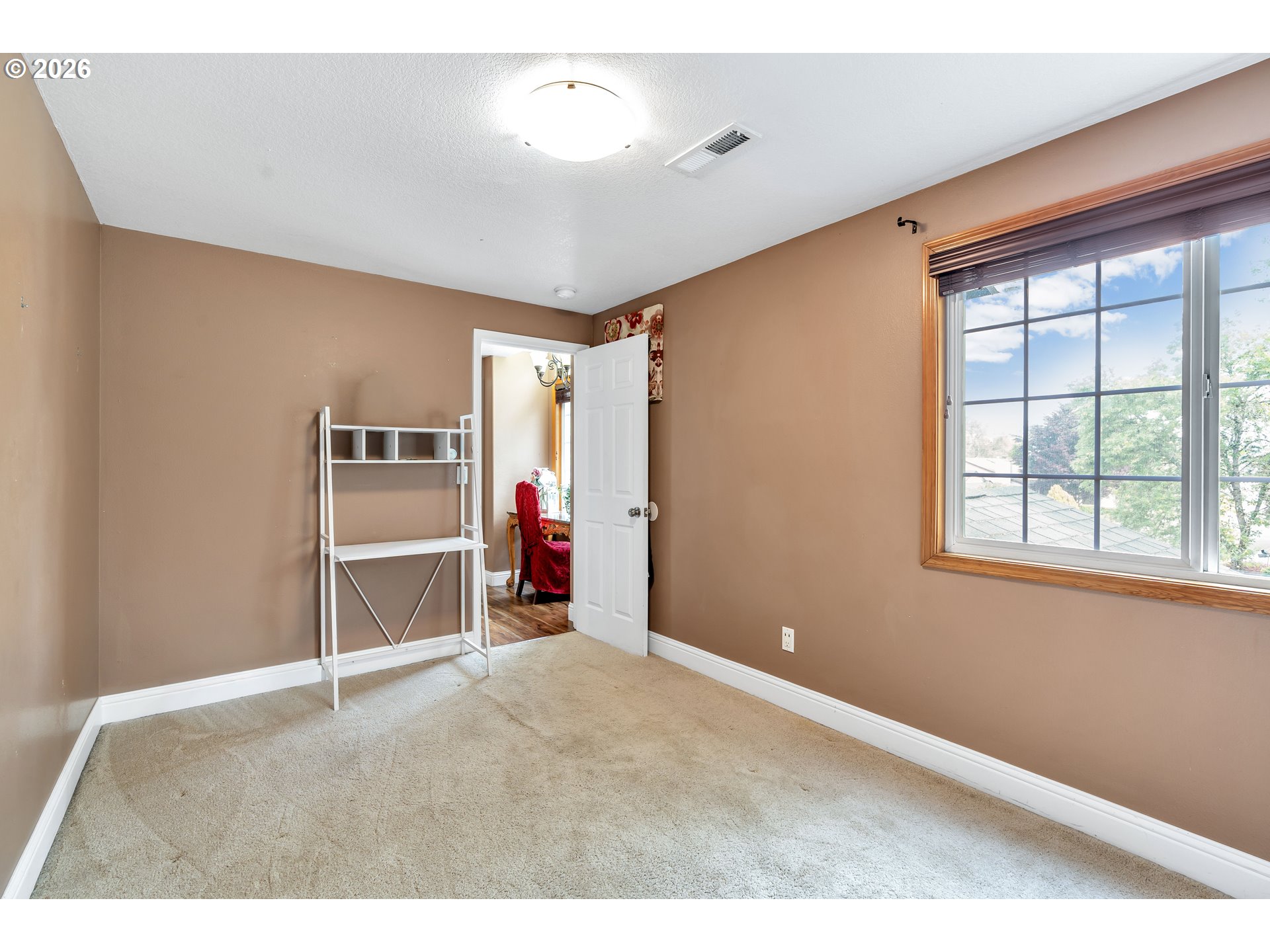 21498 Southwest Jay Street Beaverton, OR 97003 - Photo 25 of 47 a view of empty room with stairs and wooden floor