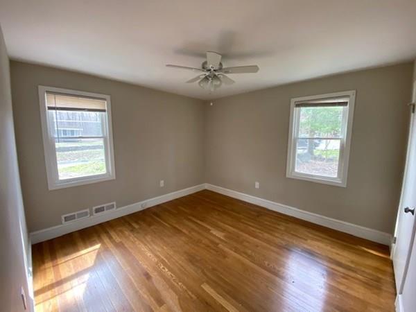 490 Rocky Hill Road Scituate, RI 02857 - Photo 19 of 33 a view of an empty room with wooden floor and a window