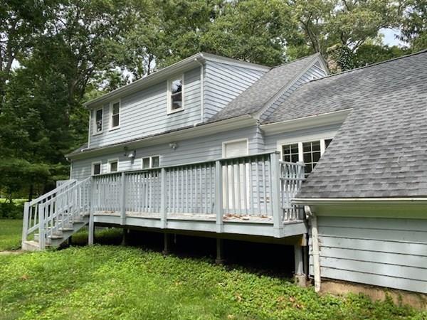 490 Rocky Hill Road Scituate, RI 02857 - Photo 3 of 33 a view of backyard with deck and garden