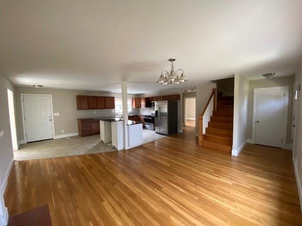 490 Rocky Hill Road Scituate, RI 02857 - Photo 5 of 33 a view of open kitchen with wooden floor and electronic appliances
