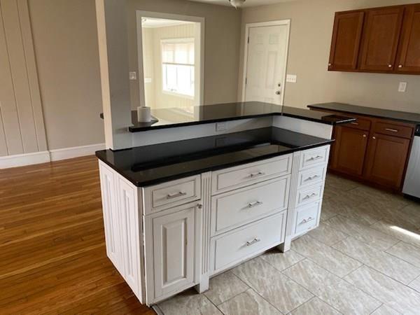 490 Rocky Hill Road Scituate, RI 02857 - Photo 9 of 33 a kitchen with granite countertop white cabinets and sink