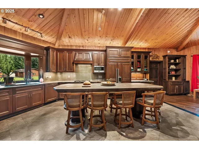 a view of a kitchen with a sink and cabinets