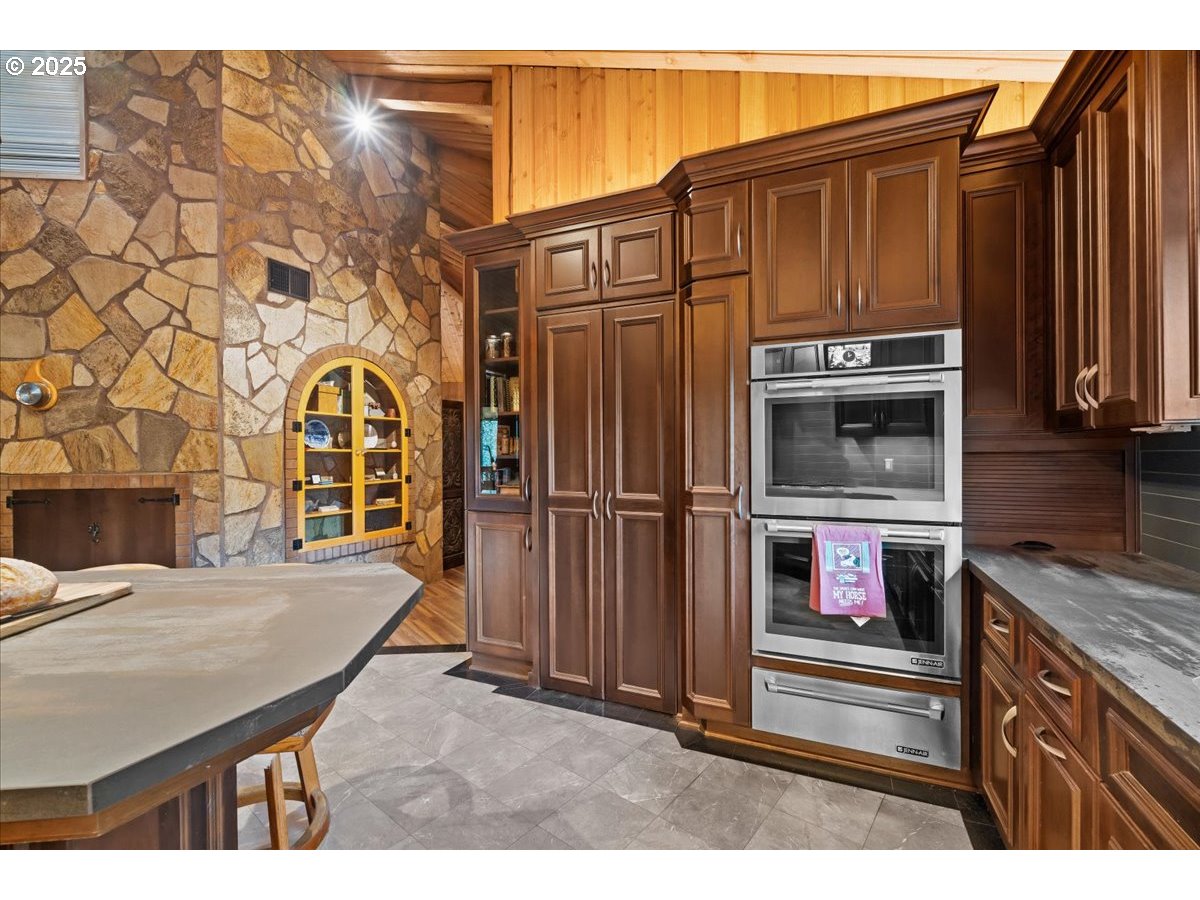 51720 Northwest Hayward Road Manning, OR 97125 - Photo 13 of 48 a view of a kitchen with a sink and cabinets