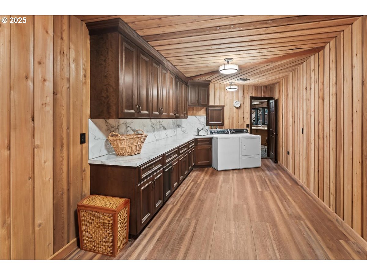 51720 Northwest Hayward Road Manning, OR 97125 - Photo 35 of 48 a open kitchen with a sink and wooden cabinets
