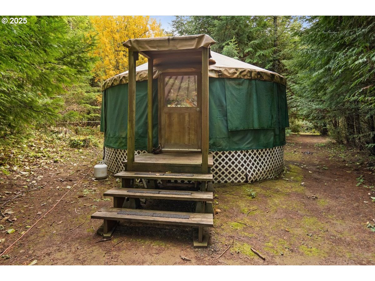 51720 Northwest Hayward Road Manning, OR 97125 - Photo 43 of 48 a front view of a house with a garden